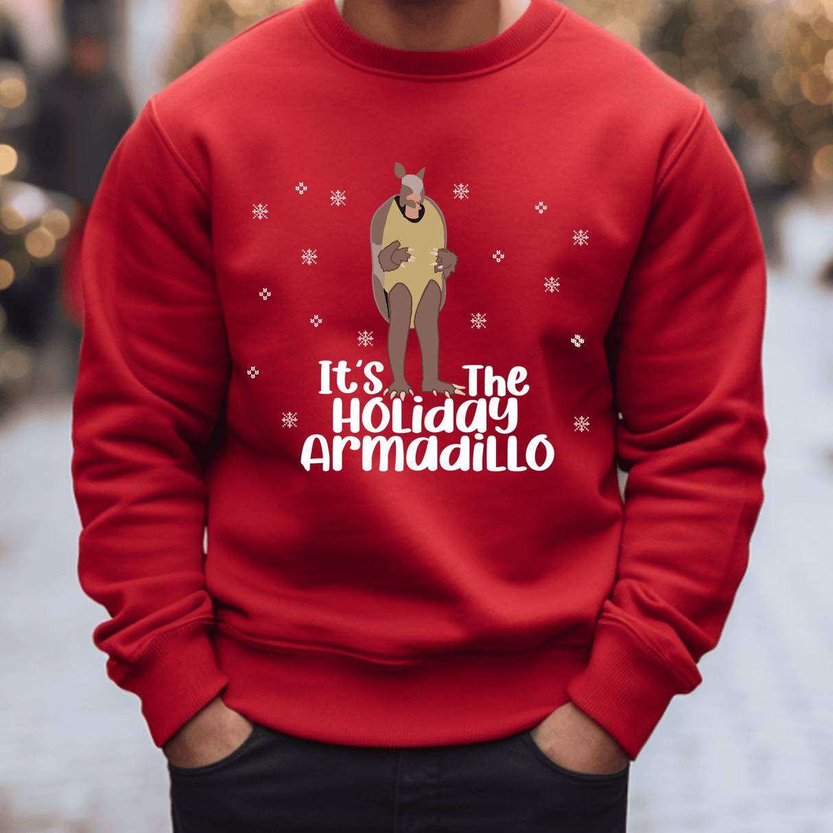 a man wearing a red sweater that says it's the holiday armadillo