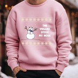 a person wearing a pink sweater with a snowman on it