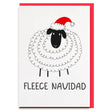 a card with a sheep wearing a santa hat