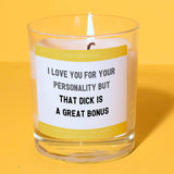 a candle with a quote on it sitting on a table