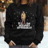 a woman wearing a black sweater with a kangaroo on it