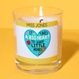 a glass candle with a picture of a heart on it