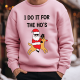 a man wearing a pink sweatshirt with a santa clause on it