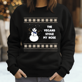 a person wearing a black sweater with a snowman on it