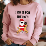 a woman wearing a pink sweatshirt with a santa clause on it