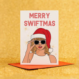 a card with a picture of a woman wearing a santa hat and sunglasses