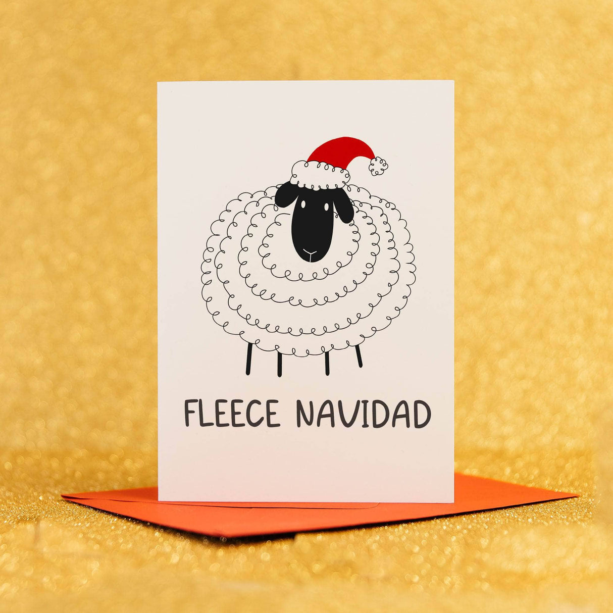 a card with a picture of a sheep wearing a santa hat